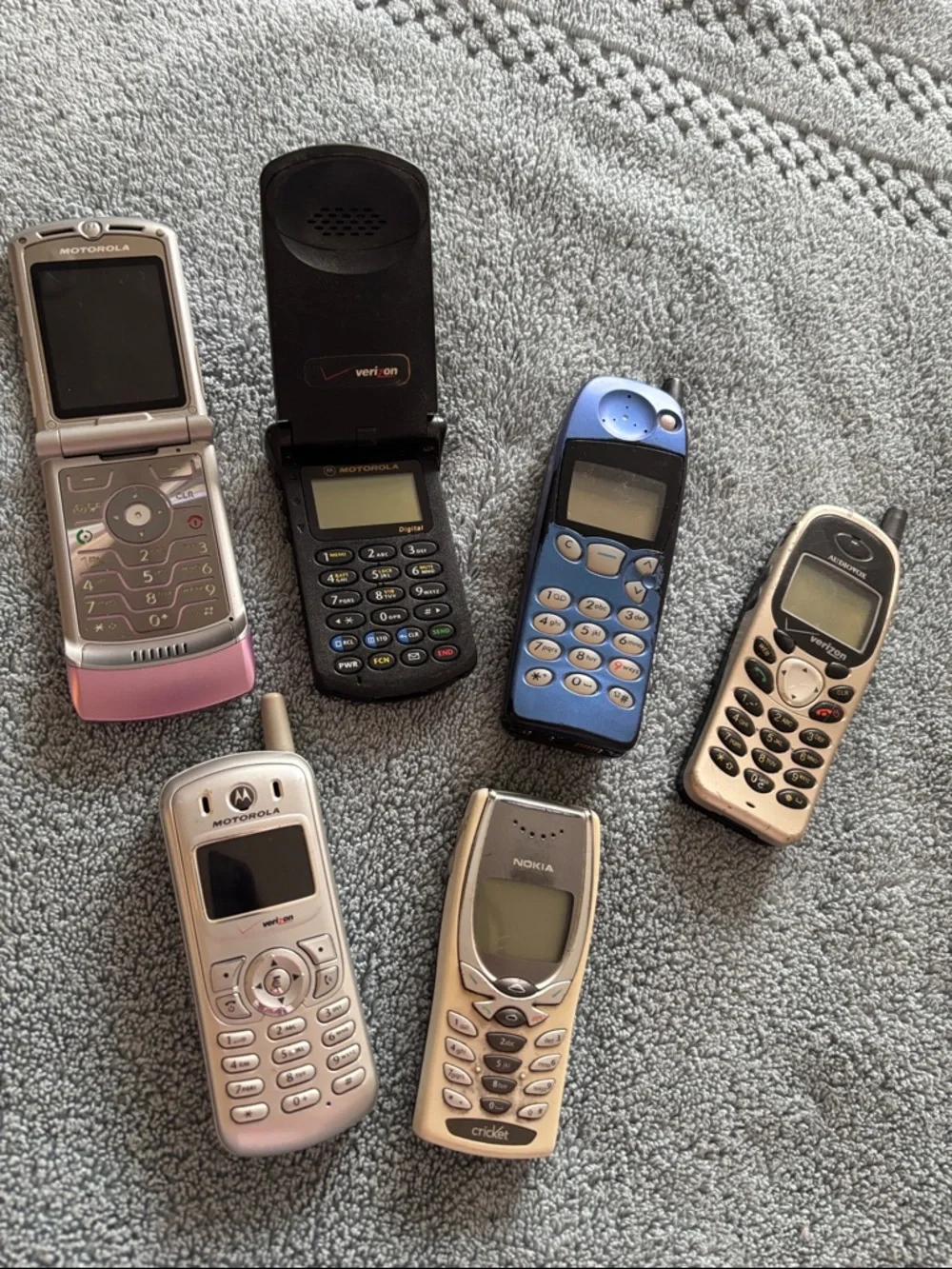 Vintage Collection of cell phones includes StarTAC and Pink Flip